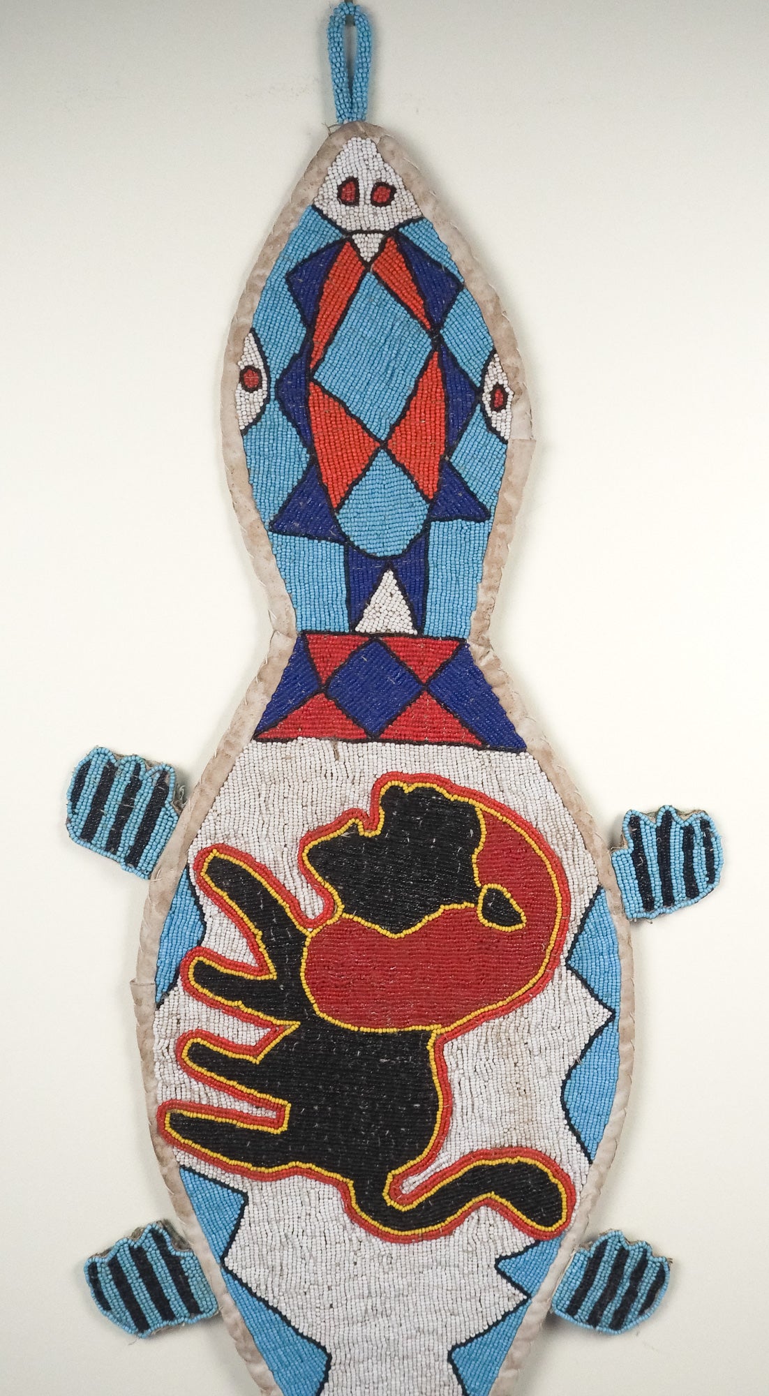 Namibia: beaded gecko wall hanging, blue and red (unframed)